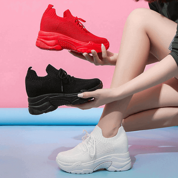 Lightweight sneakers for women in red black and white knit fabric with chunky soles paired with casual outfit